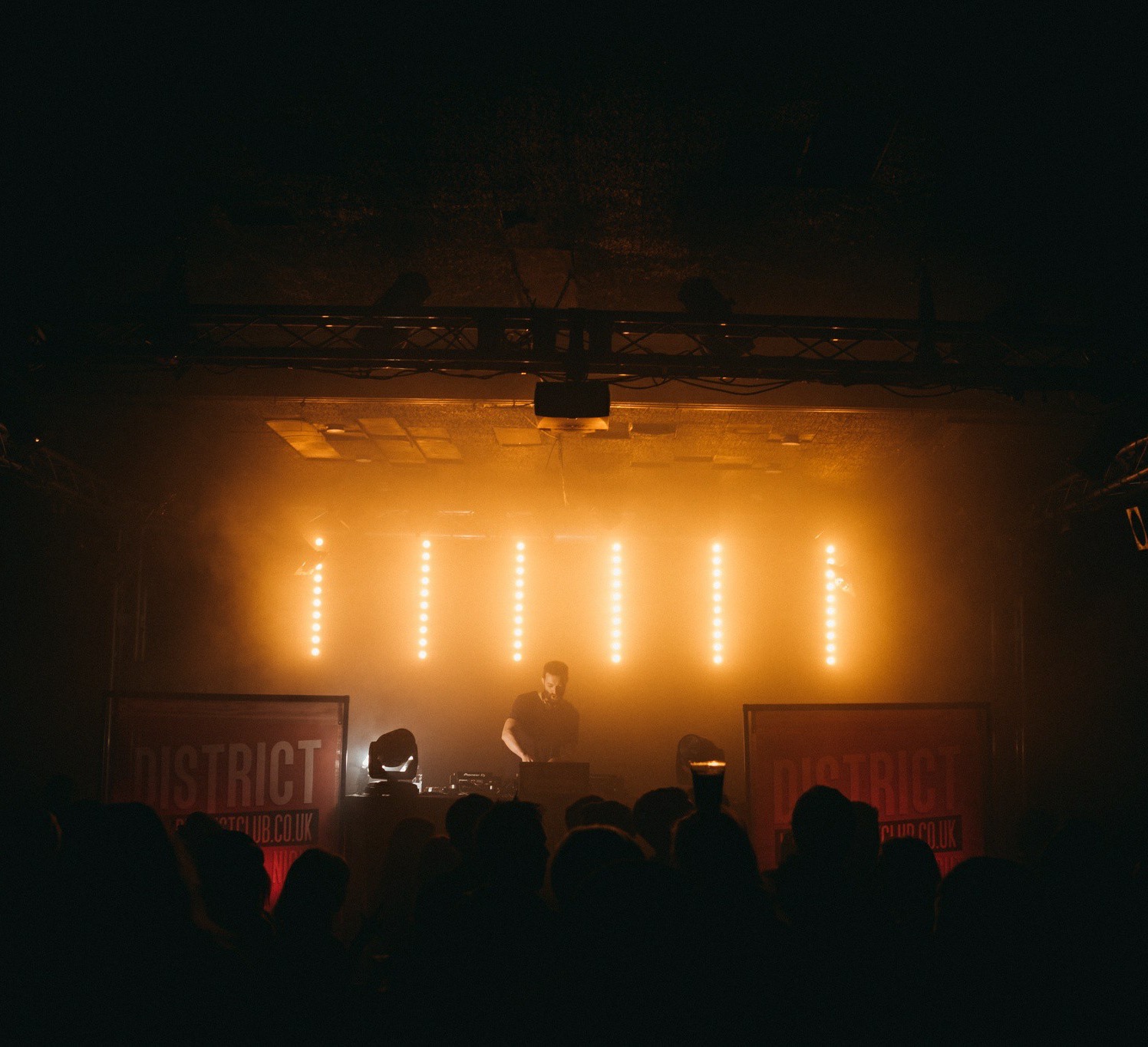Ryan Stanikk's alternative club night with atmospheric stage lighting and a crowd in silhouette in Southampton
